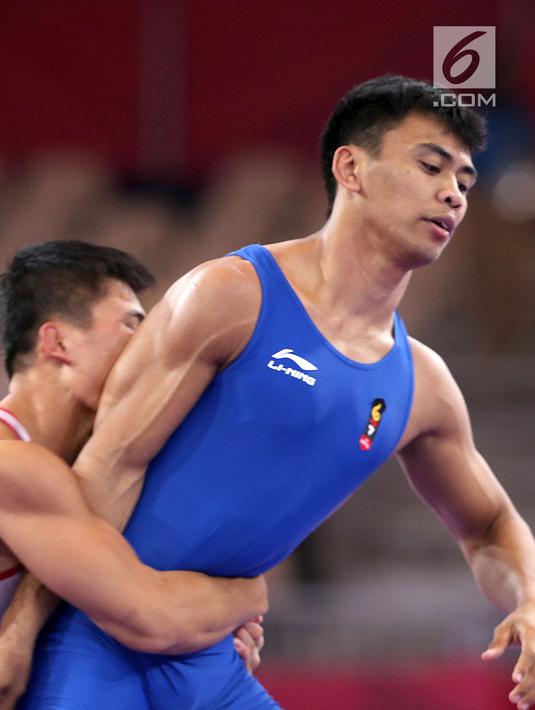 Pada perdelapan final, Muhammad Aliansyah menang atas lawanya dengan skor 2 - 2 dan masuk perempat final. (Liputan6.com/Fery Pradolo)