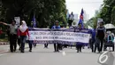 Puluhan buruh migran menggelar aksi unjuk rasa di Istana Negara, Jakarta, Kamis (18/12/2014). (Liputan6.com/Faizal Fanani)
