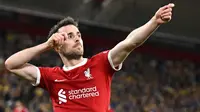 Pemain Liverpool, Diogo Jota melakukan selebrasi setelah mencetak gol kedua timnya ke gawang Union Saint-Gilloise pada laga Grup E Liga Europa 2023/2024 yang berlangsung di Anfield, Inggris, Jumat (6/10/2023) dini hari WIB. Liverpool menang dengan skor 2-0. (AFP/Oli Scarff)