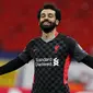 Striker Liverpool, Mohamed Salah, melakukan selebrasi usai mencetak gol ke gawang RB Leipzig pada laga Liga Champions di Stadion Puskas, Rabu (17/2/2021). Liverpool menang dengan skor 2-0. (AP/Laszlo Balogh)
