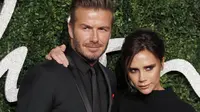 David Beckham dan Victoria Beckham memang telah menjadi salah satu pasangan selebriti Hollywood yang paling romantis dan membuat iri orang banyak akan keharmonisannya. (AFP/JUSTIN TALLIS)