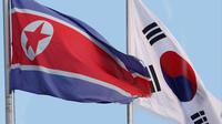 Bendera Korea Utara dan Korea Selatan berkibar berdampingan - AFP