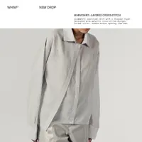 Kemeja oversized asimetris TANGAN WHIM 01 dengan layer diagonal dan didekorasi dengan desain cross-stitch metalik. (Foto: Instagram @tanganofficial)