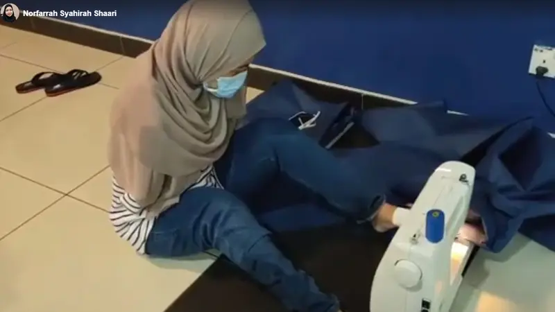 Inspiratif, Wanita Difabel Menjahit APD dengan Kakinya untuk Tenaga Medis