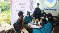 Kegiatan vaksinasi yang digelar DPD Nasdem Jawa Barat menargetkan 30 dosis akan didistribusi ke masyrakat. Foto (Istimewa)