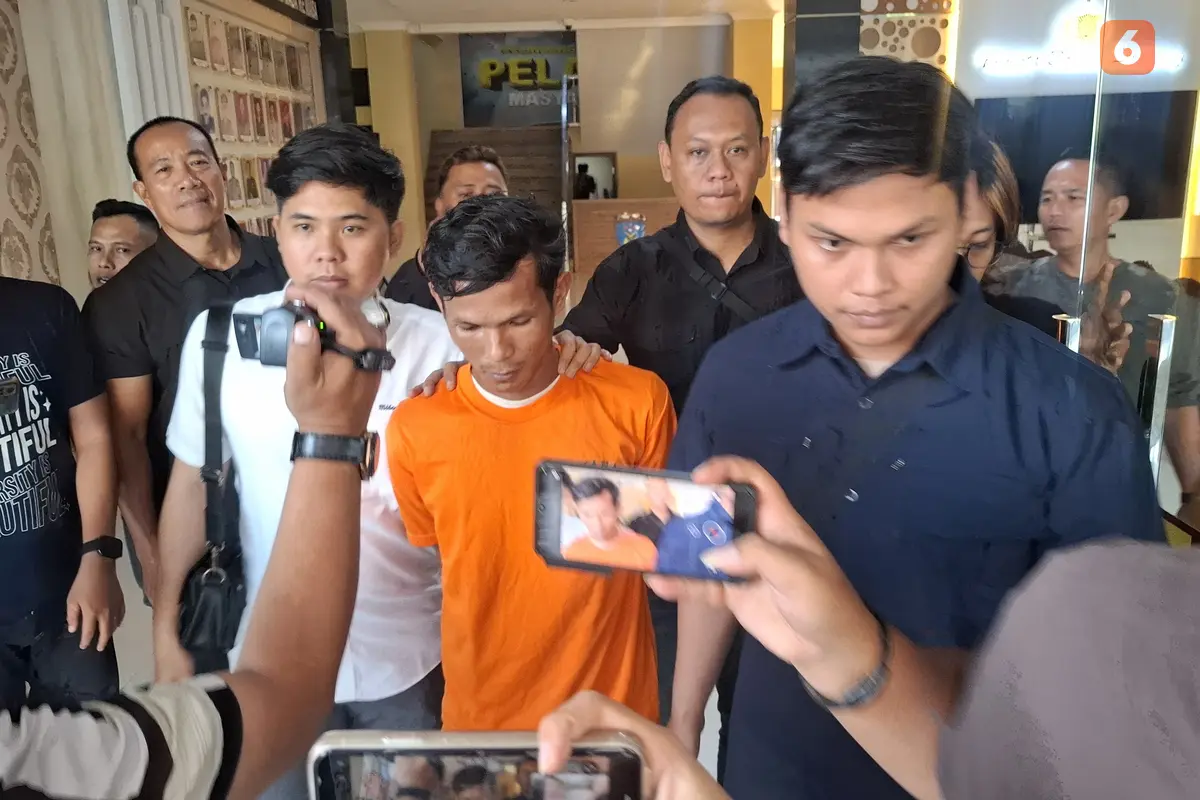 Tersangka Hengki pembunuh istrinya sendiri di Bandar Lampung. Foto : (Liputan6.com/Ardi).
