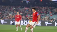 Kapten Manchester United Harry Maguire dalam pertandingan persahabatan melawan Melbourne Victori di Melbourne Cricket Ground, 15 Juli 2022. MU menang 4-1. (Martin KEEP / AFP)