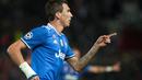 Ekspresi striker Juventus, Mario Mandzukic, setelah mencetak gol ketiga ke gawang Sevilla pada laga kelima Grup H Liga Champions di Estadio Ramon Sanchez Pizjuan, Selasa (22/11/2016). (AFP/Jorge Guerrero)