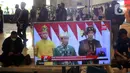 Layar televisi memperlihatkan pidato kenegaraan Presiden Joko Widodo atau Jokowi dalam Sidang Tahunan MPR, DPR, DPD di Gedung Nusantara, Jakarta, Selasa (16/8/2022). Di Gedung Nusantara, Presiden Jokowi akan menyampaikan pidato pada Sidang Tahunan MPR RI Tahun 2022 dan pidato kenegaraan dalam rangka Hari Ulang Tahun (HUT) ke-77 Kemerdekaan RI pada Sidang Bersama DPR RI dan DPD RI Tahun 2022. (Liputan6 com/Angga Yuniar)