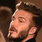 3. David Beckham, mantan bintang Inggris ini memang terkenal sebagai salah satu pesepak bola yang memiliki gaya stylish. Mantan gelandang MU ini kerap memiliki gaya rambut yang menjadi trendsetter. (AFP/Jewel Samad)