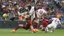 <p>Hasil ini membuat AS Roma masih di urutan lima klasemen dengan 57 poin dari 32 laga. Sedangkan Milan di posisi lima dengan poin sama. (AP Photo/Gregorio Borgia)</p>