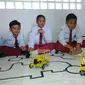 Total poin yang bisa dikumpulkan tim robot SD Muhammadiyah 4 Surabaya itu mengungguli tim tangguh dari Tiongkok. (Liputan6.com/Dhimas Prasaja)