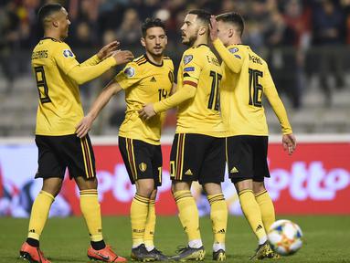 Perayaan gol dari kaki Eden Hazard pada laga perdana Kualifikasi Piala Eropa 2020 Grup I yang berlangsung di Stadion Roi Baudouin, Brussels, Jumat (22/3). Belgia menang 3-1 atas Rusia. (AFP/John Thys)