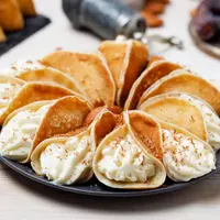 ilustrasi kue manja qatayef/Nailya Yakubova/Shutterstock