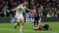 Bek Real Madrid asal Spanyol #31, Jacobo Ramon (kiri), merayakan gol kedua mereka selama pertandingan liga Spanyol antara Real Madrid CF dan RCD Mallorca di Stadion Santiago Bernabeu di Madrid,&nbsp;Kamis dini hari WIB (15-5-2025). (Pierre-Philippe MARCOU/AFP)
