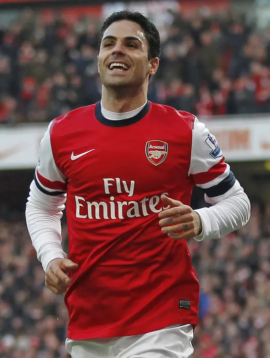 3. Mikel Arteta - Seorang metronom terbaik saat menjabat sebagai jendral lapangan teh Gunners. Satu hal yang tak akan pernah kalian lihat adalah keegoisan ia saat memonopoli bola. (AFP/Ian Kington)