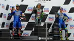 Pembalap Petronas Yamaha, Franco Morbidelli, bersama Alex Rins dan Joan Mir, melakukan selebrasi di atas podium usai balapan MotoGP Teruel, Minggu (25/10/2020). Morbidelli berhasil finis pertama dengan catatan waktu 41 menit 47,652 detik. (AP/Jose Breton)
