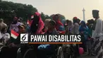 Ratusan penyandang disabilitas menggelar pawai budaya. Mereka berjalan kaki dari kawasan Monumen Nasional menuju Hotel Indonesia, Selasa (27/8/2019). Menggunakan berbagai pakaian daerah, mereka menyampaikan sejumlah tuntutan.