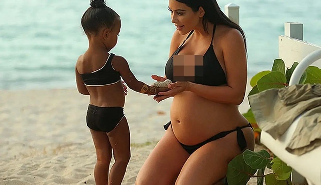 Kim Kardashian tetap cantik dan memanjakan North West saat ia hamil anak keduanya, Saint West. (People)