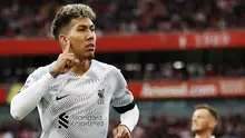 Pemain Liverpool, Roberto Firmino, melakukan selebrasi setelah mencetak gol ke gawang Arsenal pada laga Liga Inggris di Stadion Emirates, (9/10/2022). The Reds masih berusaha untuk memperpanjang kontrak Firmino yang akan habis di akhir musin ini. Sejak didatangkan ke Anfield pada tahun 2015 silam, Firmino sukses menjadi andalan Jurgen Klopp di lini serang. (AFP/Ian Kington)