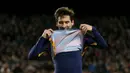 8. Penyerang Barcelona, Lionel Messi, merayakan gol yang dicetaknya ke gawang Sevilla pada laga La Liga Spanyol di Stadion Camp Nou, Minggu (28/2/2016). Barcelona berhasil menang 2-1 atas Sevilla. (Reuters/Albert Gea)