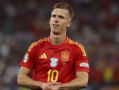 Daniel Olmo merayakan gol bunuh diri Prancis dan gol kedua Spanyol saat laga semifinal Euro 2024 di Arena Sepak Bola Munich di Munich pada 9 Juli 2024. Saat ini, Daniel Olmo sudah mengoleksi tiga gol dan berpeluang meraih gelar pencetak gol terbanyak mengingat Spanyol akan berlaga di final Euro 2024 melawan Inggris. (FRANCK FIFE/AFP)