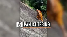 TANPA PENGAMAN, BIKSU LEWATI TEBING CURAM DENGAN BERJALAN KAKI