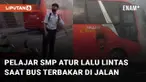 Aksi seorang pelajar SMP atur lalu lintas saat ada Bus terbakar di jalan mengundang perhatian
