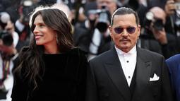 Johnny Depp akhirnya perdana muncul di Festival Film Cannes 2023 usai berseteru dengan Amber Heard. (Photo by Scott Garfitt/Invision/AP)