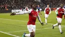 Ekspresi pemain Arsenal, Danny Welbeck usai membobol gawang CSKA Moscow pada leg kedua Liga Europa di CSKA Arena, Russia, (12/3/2018). Arsenal lolos ke Semifinal dengan agregat gol 6-3. (AP/Pavel Golovkin)