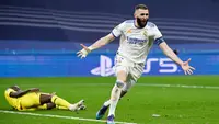 Karim Benzema lagi-lagi menjadi pahlawan dan memastikan Real Madrid menggenggam satu tiket ke semifinal Liga Champions 2021/2022 secara dramatis. (AFP/Pierre- Philippe Marcou)