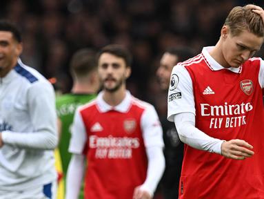 Arsenal dipastikan gagal menyabet juara Liga Inggris 2022/2023 pada Minggu (21/5/2023) dini hari WIB. Kekalahan 0-1 di markas Nottingham Forest membuat The Gunners tak lagi bisa mengejar perolehan poin Man City. Berikut ini 4 momen kunci yang buat 248 hari Arsenal di puncak klasemen jadi sia-sia. (AFP/Paul Ellis)