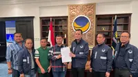 Dewan Pimpinan Pusat (DPP) NasDem memberi surat rekomendasi ke Hendriyanto Sitorus dan Samsul Tanjung sebagai pasangan calon bupati dan calon wakil bupati Labuhanbatu Utara (Labura) untuk Pilkada 2024. (Dok: NasDem)