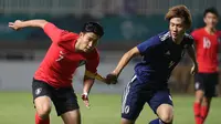 Duel Korsel vs Jepang di partai final sepak bola Asian Games 2018 di Stadion Pakansari, Cibinong, Sabtu (1/9/2018). (Bola.com/Dok. INASGOC)