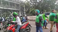 Pengemudi Ojek Online melakukan aksi unjuk rasa di sekitar Monas, Jakarta Pusat. (Ady Anugrahadi/Liputan6.com)