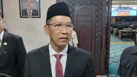 Penjabat (Pj) Gubernur DKI Jakarta Heru Budi Hartono usai menghadiri Penyampaian Jawaban Pendapat Gubernur atas Pandangan Umum Fraksi-Fraksi terhadap Raperda tentang Pertanggungjawaban Pelaksanaan APBD (P2APBD) Tahun Anggaran 2022. (Liputan6.com/Winda Nelfira)
