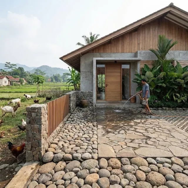Desain Rumah dengan Decking Batu Alam (Gemini AI)