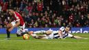 Penyerang MU, Anthony Martial dijatuhkan pemain WBA, Gareth McAuley pada laga Liga Premier Inggris di Stadion Old Trafford, Inggris, Sabtu (7/11/2015). (Reuters/Andrew Yates)