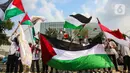 Dalam aksinya, mereka menyerukan agar seluruh pemimpin negara Islam untuk bersatu melawan genozida yang dilakukan oleh Israel. (Liputan6.com/Angga Yuniar)