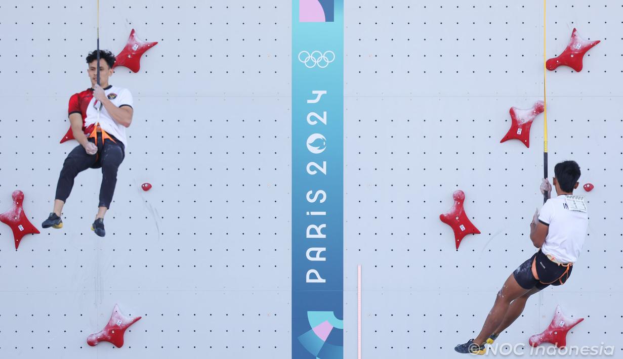 Atlet panjat tebing Indonesia, Veddriq Leonardo (kiri) berhasil mengungguli kompatriotnya, Rahmad Adi Mulyono  pada babak eliminasi cabor panjat tebing nomor speed putra Olimpiade Paris 2024 di Le Bourget Climbing Venue, Paris, Selasa (6/8/2024). (Dok. NOC Indonesia)