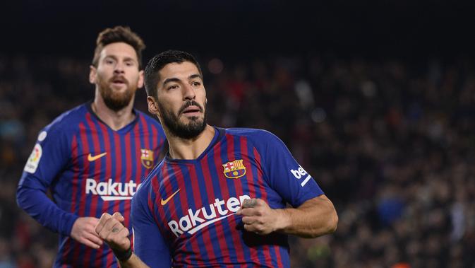 Luis Suarez menyumbangkan gol kedua untuk Barcelona pada laga lanjutan La Liga yang berlangsung di stadion Camp Nou, Minggu (20/1). Barcelona menang 3-1 atas Leganes. (AFP/Josep Lago)