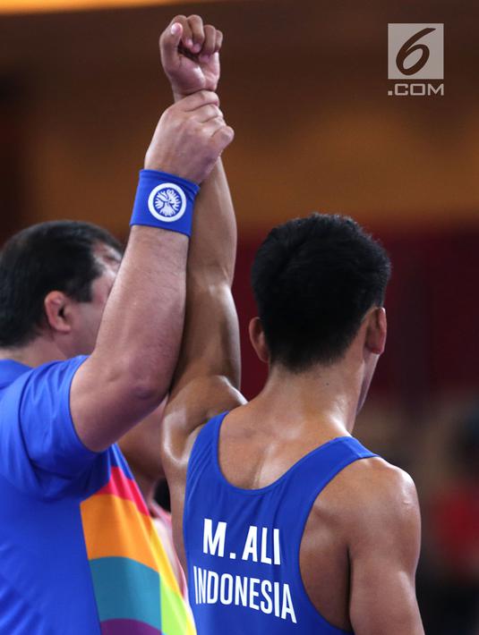 Pada perdelapan final, Muhammad Aliansyah menang atas lawanya dengan skor 2 - 2 dan masuk perempat final. (Liputan6.com/Fery Pradolo)