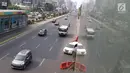 Kendaraan melintas di Jalan Jenderal Sudirman, Jakarta, Minggu (14/10). Sesuai Pergub DKI Jakarta, aturan ganjil genap diperpanjang dari 15 Oktober hingga 31 Desember 2018. (Liputan6.com/Immanuel Antonius)