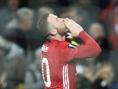 Manchester United meraih kemenangan 4-0 atas Feyenoord pada matchday kelima Grup A Liga Europa 2016-2017, di Stadion Old Trafford, Jumat (25/11/2016) dini hari WIB. Wayne Rooney mencetak gol pertama MU. (AFP/Oli Scarff)
