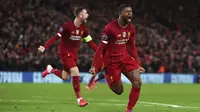 Gelandang Liverpool, Georginio Wijnaldum berselebrasi usai mencetak gol ke gawang Atletico Madrid pada pertandingan leg kedua babak 16 besar Liga Champions di di stadion Anfield, Inggris (12/3/2020). Atletico menang atas 3-2 atas Liverpool dengan agregat 4-2. (Peter Byrne/PA via AP)