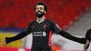Striker Liverpool, Mohamed Salah, melakukan selebrasi usai mencetak gol ke gawang RB Leipzig pada laga Liga Champions di Stadion Puskas, Rabu (17/2/2021). Liverpool menang dengan skor 2-0. (AP/Laszlo Balogh)