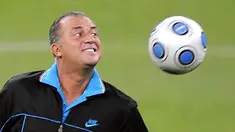Coach of the Turkish team Fatih Terim plays with the ball during a training session in Madrid, on March 27, 2009, on the eve of a FIFA World Cup South Africa 2010 qualifier match against Spain. AFP PHOTO/PIERRE-PHILIPPE MARCOU