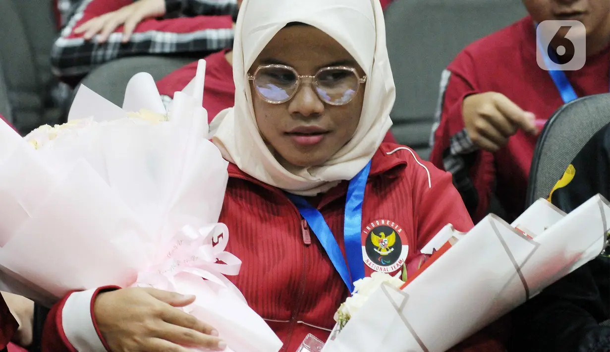 Atlet disabilitas tunanetra Firstania Kayla asal DKI Jakarta berhasil meraih medali perunggu cabang olahraga renang. (merdeka.com/Imam Buhori)