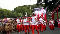 Presiden Jokowi membawa obor Asian Games 2018. (Merdeka.com)