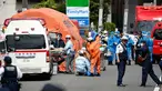 Tim penyelamat bekerja di lokasi penusukan massal di Kawasaki, dekat Tokyo, Jepang, Selasa (28/5/2019). Sebuah aksi penusukan massal membuat panik warga Jepang pada pagi hari ini. (Kyodo News via AP)